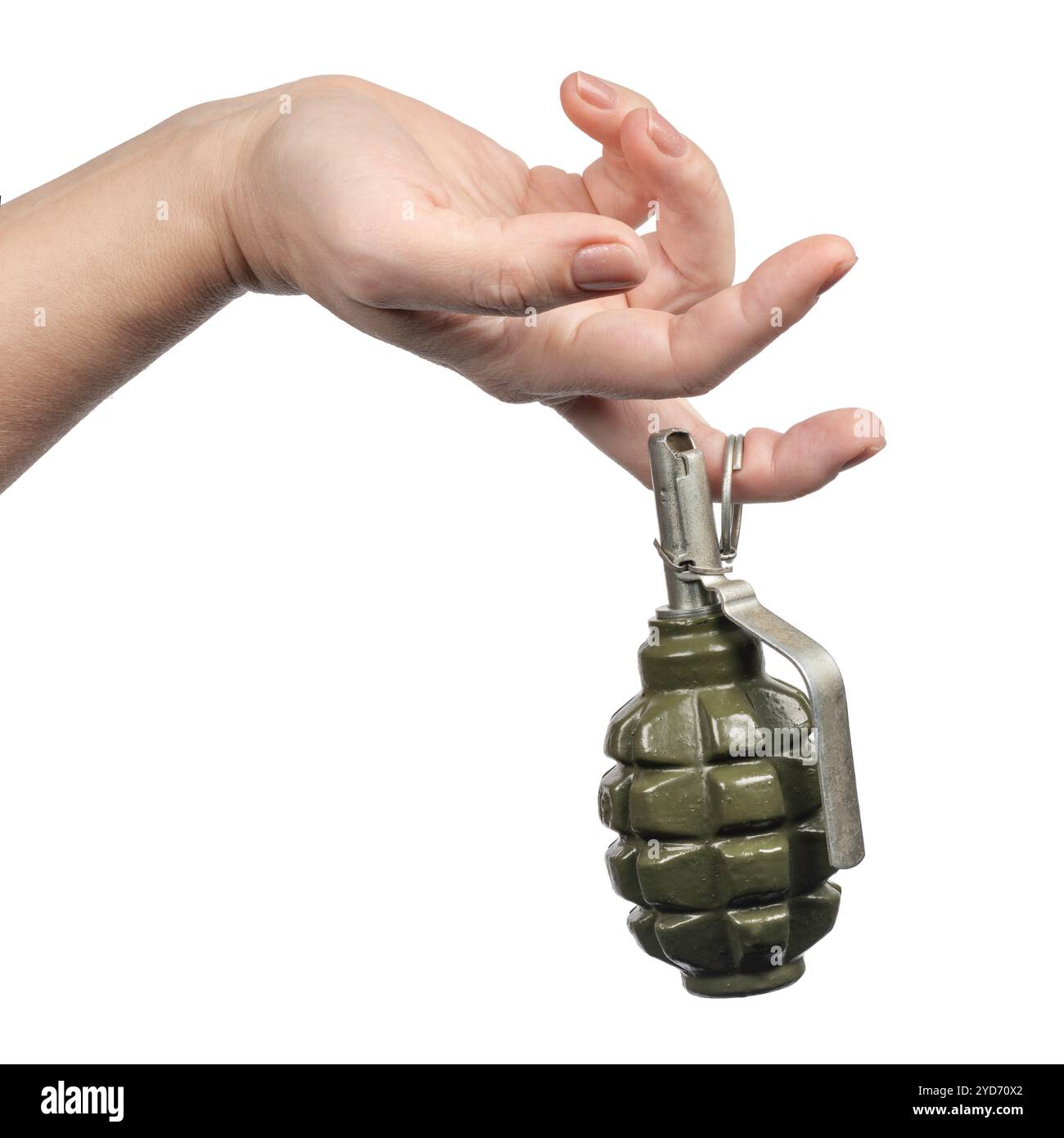 Woman`s hand holds on finger the old green shrapnel Hand Grenade Weapon of War, Isolated White Stock Photo